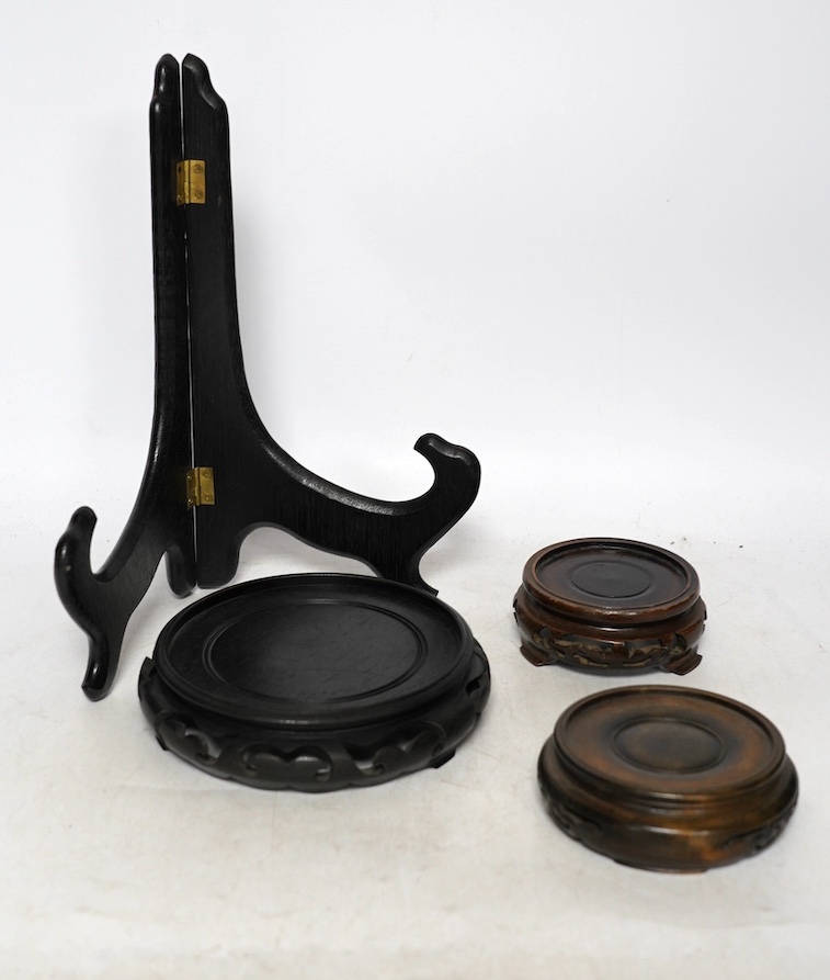 A collection of 19th century and later Chinese carved hardwood stands, largest 23cm diameter. Condition - varies